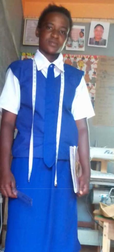 A person in blue and white shirt holding book